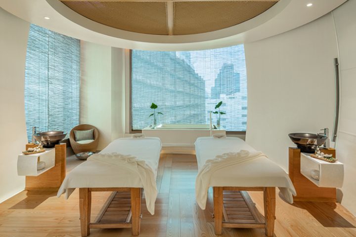 Le Méridien Bangkok spa. Gay hotel spa package with two massage beds, sinks, and a city view. A cheap spa day for gay men's travel.