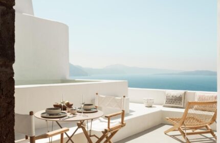Armenaki Santorini balcony view. Cheap gay hotels in Santorini offer stunning views. Relax at this gay-friendly hotel. #GayTravel #Santorini