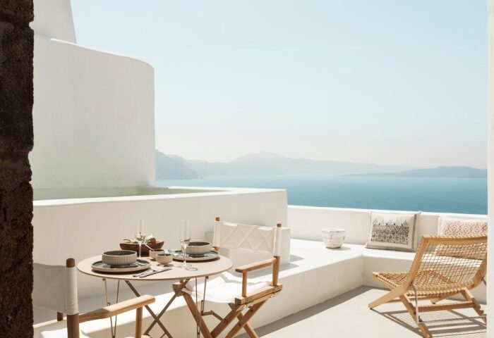 Armenaki Santorini balcony view. Cheap gay hotels in Santorini offer stunning views. Relax at this gay-friendly hotel. #GayTravel #Santorini