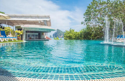 PP Princess Resort rooftop pool with Ton Sai beachfront view. Cheap gay hotels offer luxury. Fountain and bar enhance the experience.