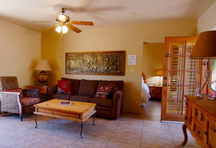 El Mirasol Villas, Palm Springs: Interior view of a villa at this gay men-only resort, featuring a living area and a glimpse into the bedroom.