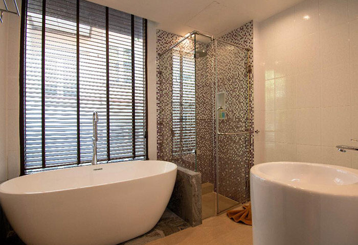 Bathroom at Samed Pavilion Resort, a cheap hotel near gay bars and the beachfront in Koh Samet, Thailand. Bathtub and shower visible.