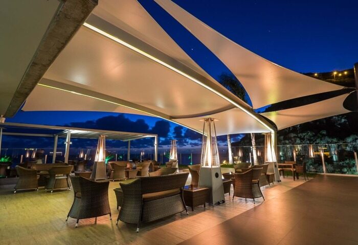 Saccharum, Madeira hotel's outdoor lounge at night. Cheap luxury beachfront spa hotel in Portugal. Gay travel advice.