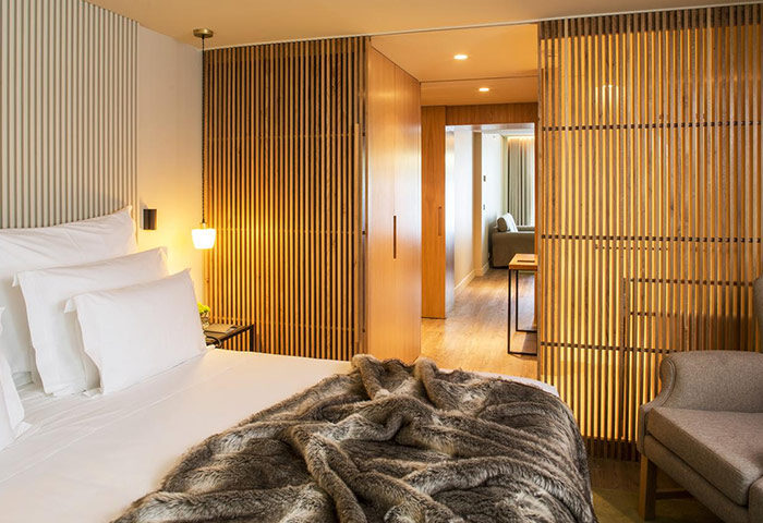 Memmo Principe Real Design Hotel room in Lisbon. Cheap luxury gay hotel with wooden accents and a cozy, inviting atmosphere. Gay travel advice.