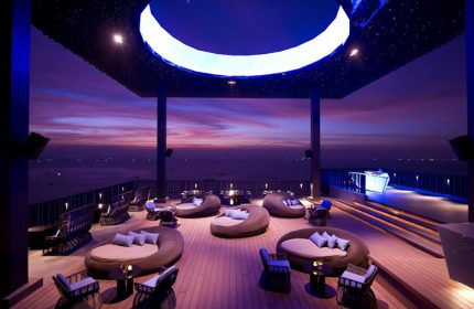 Hilton Pattaya rooftop bar at sunset. A cheap luxury gay hotel in Pattaya City Center. Perfect for gay travel and relaxation.