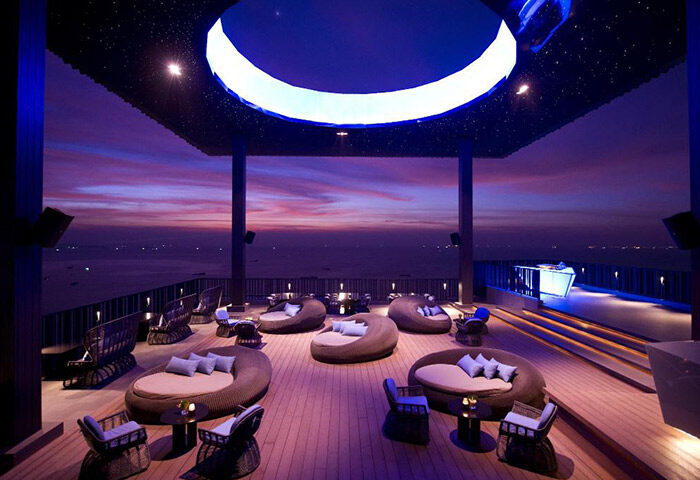 Hilton Pattaya rooftop bar at sunset. A cheap luxury gay hotel in Pattaya City Center. Perfect for gay travel and relaxation.
