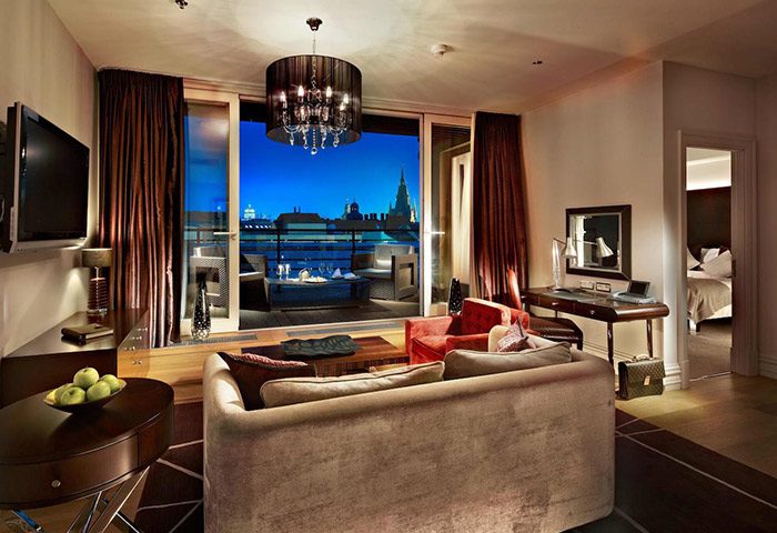 Luxury suite at The Grand Mark Prague Hotel near the gayborhood. Balcony view of Prague. Instagramable hotel for gay men travel advice.