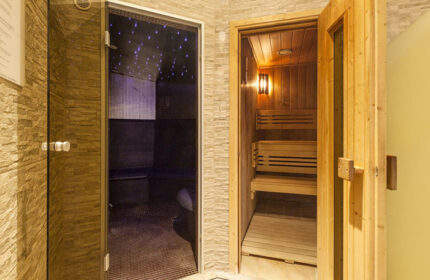 Hotel Kings Court sauna. Luxury gay hotel in Prague Old Town. Sauna with wooden benches and steam room with starry lights.