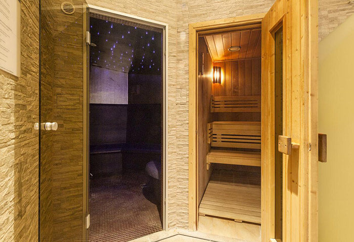 Hotel Kings Court sauna. Luxury gay hotel in Prague Old Town. Sauna with wooden benches and steam room with starry lights.