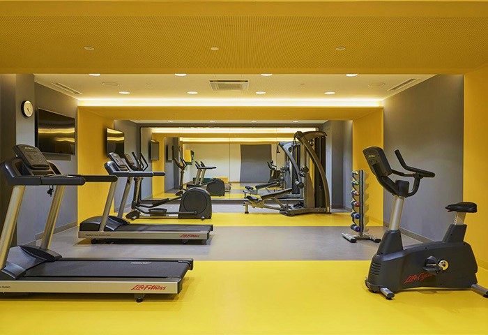 Hotel Indigo Berlin East Side Gallery gym. Treadmills, stationary bike, weights. A cheap, most booked city hotel for gay men.