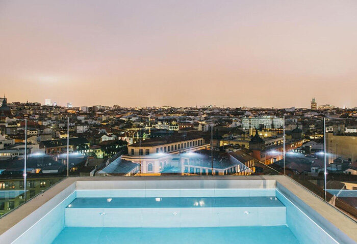 Rooftop pool at Dear Hotel Madrid, a gay-friendly hotel in Madrid's gayborhood near Gran Via, offering cheap prices and stunning city views.