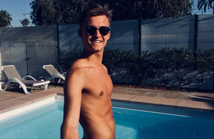 Gay man at Paso Chico Gay Hotel pool, near Yumbo Center nightlife in Playa del Ingles. Enjoying a cheap-price gay hotel in Gran Canaria.