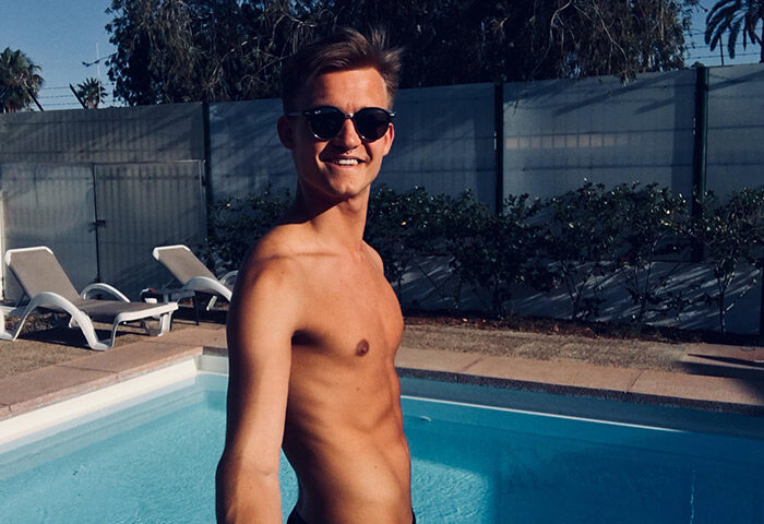 Gay man at Paso Chico Gay Hotel pool, near Yumbo Center nightlife in Playa del Ingles. Enjoying a cheap-price gay hotel in Gran Canaria.