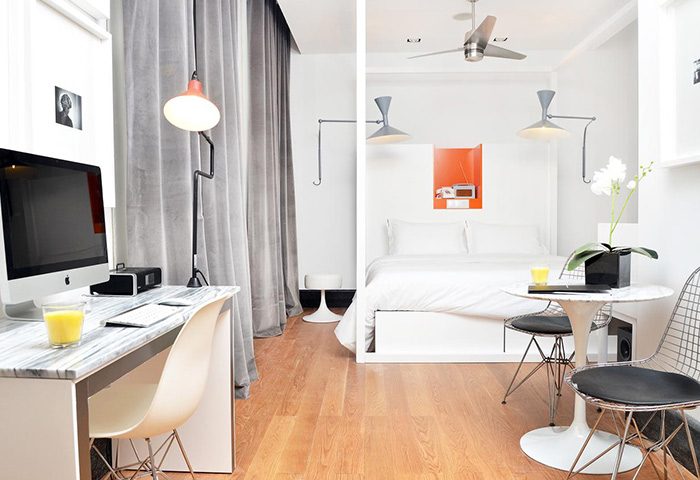 Browns Boutique Hotel room in Lisbon near gay bars. Modern design, desk, bed, and seating area. Cheap price hotel for gay travelers.