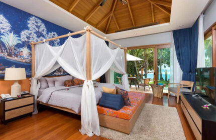 Krabi Resort Pool Villa suite interior. Gay honeymoon hotel with private pool villas. Luxury room with canopy bed and ocean view. Cheap travel.