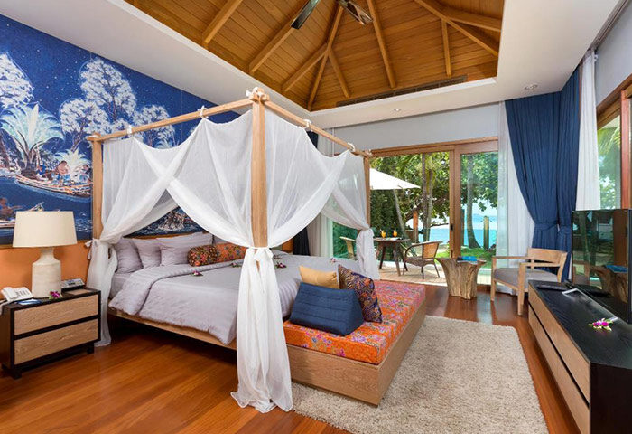 Krabi Resort Pool Villa suite interior. Gay honeymoon hotel with private pool villas. Luxury room with canopy bed and ocean view. Cheap travel.