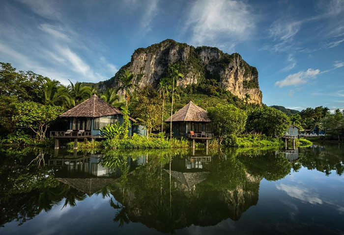 Peace Laguna Resort Krabi: Private pool villas reflected in water. Gay-friendly hotel with cheap rates, ideal for gay men travel.