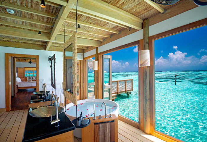 Gili Lankanfushi Maldives private pool villa bathroom with ocean view. Gay-friendly hotel for luxury travel. Maldives resort for gay men.