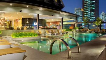 Rooftop pool at DoubleTree by Hilton Hotel Sukhumvit Bangkok. Popular gay hotel with city views. Great cheap rate hotel option for gay travelers.