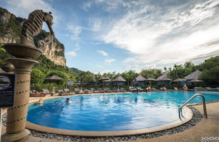 Peace Laguna Resort pool in Ao Nang, Krabi. Best gay-friendly hotel with seahorse statue, bungalows, and mountain views. Cheap & best option.