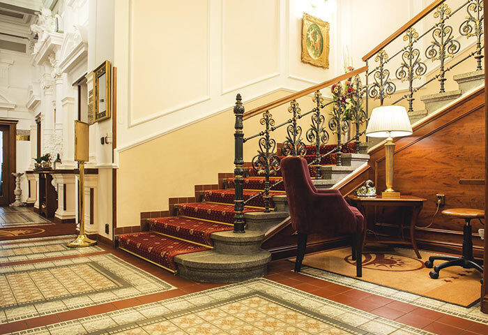 Staircase at Boutique Hotel Seven Days, a chic gay hotel in Prague's Vinohrady gayborhood. Elegant design, luxurious travel experience.