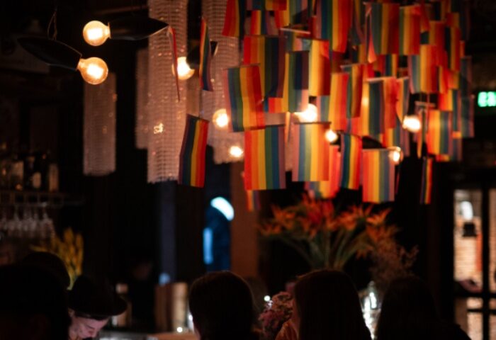Chin Chin Bar, Ho Chi Minh City. Rainbow flags hang above patrons in this gay bar. Gay travel advice in Vietnam.
