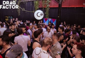 Crowded Churros con Chocolate gay club in Barcelona. Gay men socializing, drinking, and enjoying the party atmosphere. Nightlife scene.
