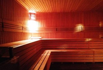 Cihangir Sauna Istanbul: Interior view of a wooden sauna with benches, for gay men's travel advice, offering relaxation in Turkey.