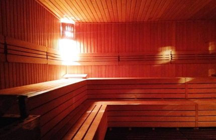 Cihangir Sauna Istanbul: Interior view of a wooden sauna with benches, for gay men's travel advice, offering relaxation in Turkey.
