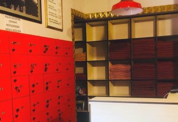 Interior of Cihangir Sauna, Istanbul. Red lockers, shelves with towels. Travel advice for gay men visiting Istanbul's gay sauna scene.