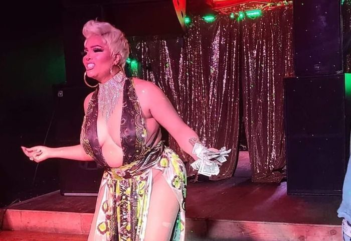 Drag queen performs at a Chicago club. Escape offers drag shows and parties for gay men visiting Chicago.