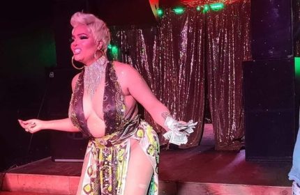 Drag queen performs at a Chicago club. Escape offers drag shows and parties for gay men visiting Chicago.