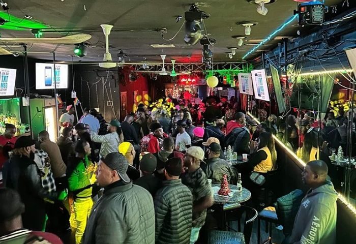 Inside Club Escape: A lively drag show party in Chicago. People gather, enjoying the vibrant atmosphere of this gay-friendly venue.