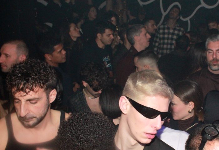 Crowded scene at Club Plastic Milano. Gay nightlife in Milan, Italy. People dancing, enjoying the music, and socializing.