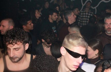 Crowded scene at Club Plastic Milano. Gay nightlife in Milan, Italy. People dancing, enjoying the music, and socializing.