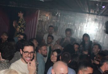 Crowd at Plastic Club Milano, a gay-friendly nightclub. People dancing, socializing, and enjoying the vibrant atmosphere. Nightlife in Milan.
