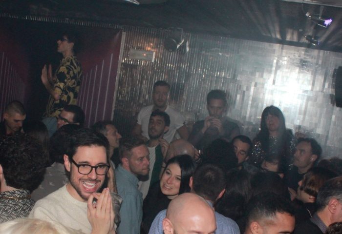 Crowd at Plastic Club Milano, a gay-friendly nightclub. People dancing, socializing, and enjoying the vibrant atmosphere. Nightlife in Milan.