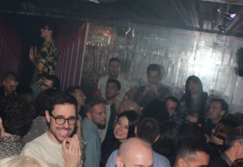 Crowd at Plastic Club Milano, a gay-friendly nightclub. People dancing, socializing, and enjoying the vibrant atmosphere. Nightlife in Milan.