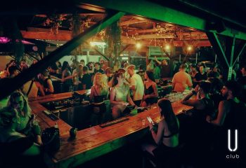 Montreal's Club Unity gay party scene: People at the bar and on the dance floor. A vibrant nightlife experience for gay men.