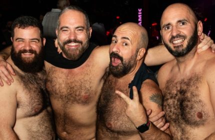 Four shirtless, bearded men pose together in Rome, Italy. Gay travel in Rome, Italy. Gay bears. Rome nightlife.