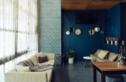 Saint Kilda Beach Hotel's cool design. Gay-friendly Melbourne beachfront hotel lounge area with sofas, mirrors, and stylish decor.