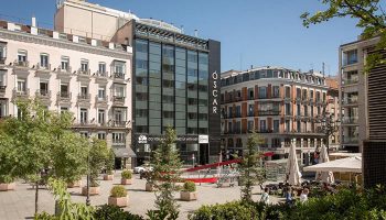 Room Mate Oscar, a cool design boutique hotel in Madrid's gayborhood, Chueca. Modern architecture blends with classic buildings.