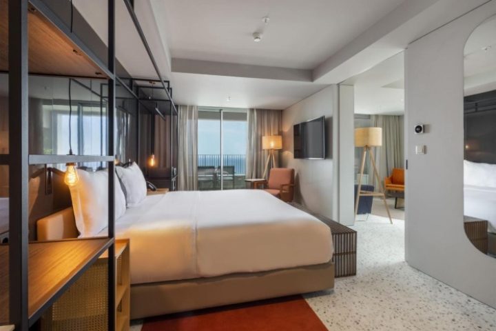 NEXT Hotel Madeira room. Modern gay-friendly beach hotel in Portugal. Balcony with ocean view. Coolest hotel on TikTok.