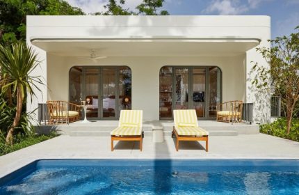 The Standard Hua Hin: Coolest gay beachfront hotel. Poolside view with lounge chairs at the gay-friendly Standard Hotel in Hua Hin, Thailand.