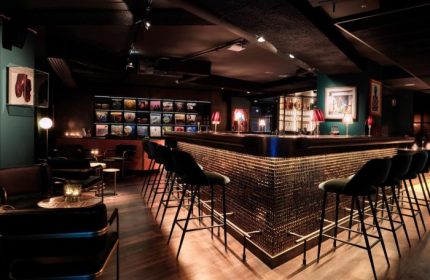 Bar at 25hours Hotel Terminus Nord, a cool gay-friendly hotel in Paris near gay bars. Stylish interior with vinyl records and mood lighting.