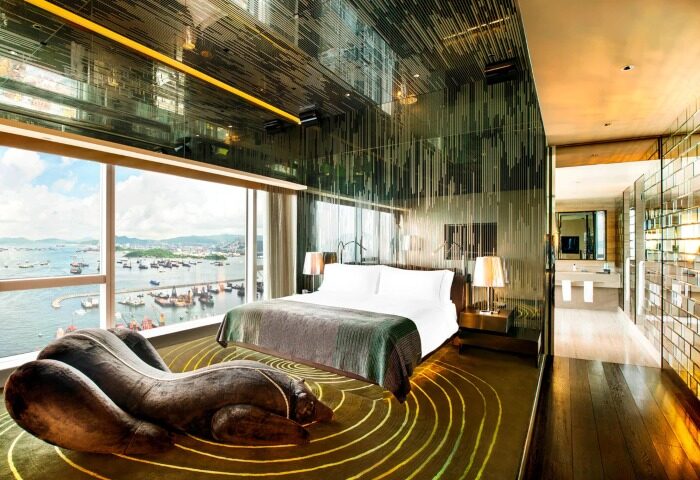 W Hong Kong hotel room with Victoria Harbour view. Crazy design, luxury gay hotel. Unique chaise lounge, mirrored ceiling. Hot travel destination.