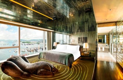 W Hong Kong hotel room with Victoria Harbour view. Crazy design, luxury gay hotel. Unique chaise lounge, mirrored ceiling. Hot travel destination.