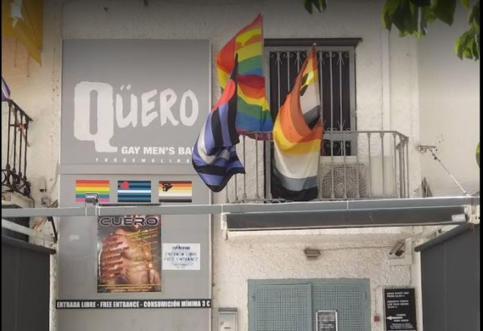Cuero Cruising Club, Torremolinos. Gay bar exterior with rainbow flags. Gay travel advice for men. Nightlife in Spain.