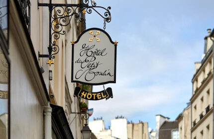 Hotel du Petit Moulin sign in Paris' Marais gayborhood. Cute & chic design hotel. A top gay-friendly destination for discerning travelers.