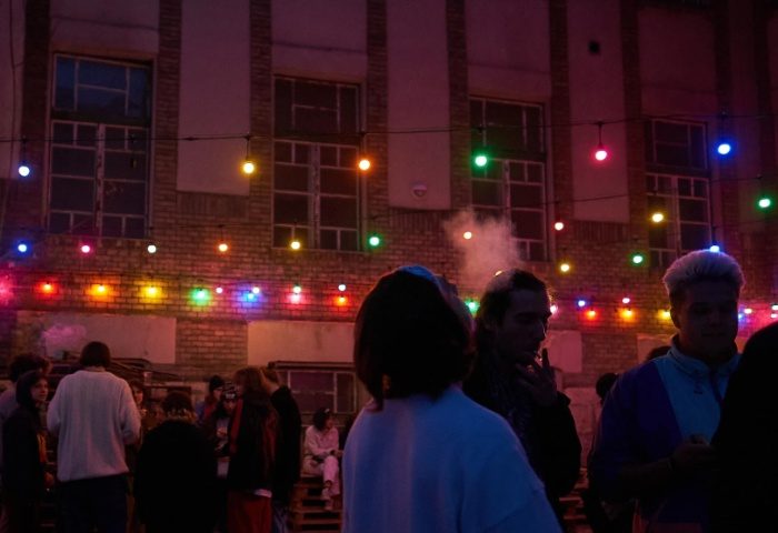 D9 Dark Nine Budapest scene. Gay men travel in Budapest. Party scene with colorful lights and people gathering at night. Budapest nightlife.